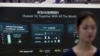 FILE - Information on Huawei's 5G equipment is seen on a screen at the World 5G Exhibition in Beijing, China, Nov. 22, 2019. 