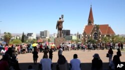 Namibians queue to cast their votes in presidential elections in Windhoek, Namibia, Nov. 27, 2024.