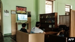 This photo taken on July 23, 2024 shows patients watching TV at the Marzoeki Mahdi Psychiatric Hospital, a national referral center for mental health services, in Bogor, West Java, Indonesia.