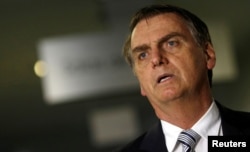 FILE - Brazil's President-elect Jair Bolsonaro arrives for a meeting in Brasilia, Nov. 20, 2018.