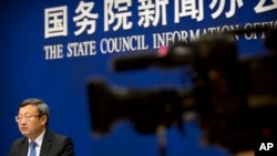 中国商务部副部长王受文2018年6月28日参加新闻发布会，就最新发表的《中国与世界贸易组织》白皮书介绍情况。