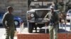 FILE - Army personnel are seen outside the military headquarters in Maseru, Lesotho.