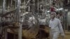 FILE - An employee walks through the Uranium Conversion Facility in Iran, March 30, 2005. Iran plans to address concerns about sanctions relief related to the nuclear deal at a meeting Tuesday in New York with U.S. Secretary of State John Kerry.