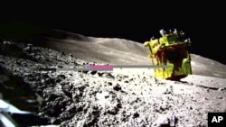 FILE - This image provided by the Japan Aerospace Exploration Agency (JAXA)/Takara Tomy/Sony Group Corporation/Doshisha University shows an image taken by a Lunar Excursion Vehicle 2 (LEV-2) of a robotic moon rover called Smart Lander for Investigating Moon, or SLIM, on the moon.