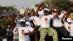 FILE - Supporters of Edgar Lungu, leader of the Patriotic Front, celebrate after Lungu narrowly won re-election, in a vote that rival Hakainde Hichilema rejected on claims of alleged rigging by the electoral commission, in Lusaka, Zambia, Aug. 15, 2016.