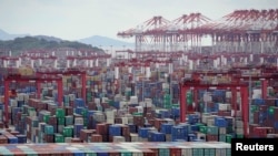 FILE - Containers are seen at the Yangshan Deep-Water Port in Shanghai, China, Oct. 19, 2020. 