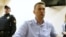 FILE - Russian opposition leader Alexei Navalny talks to journalists during a hearing at a court in Moscow, Russia, June 12, 2017. 