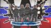 Sebuah mural yang menggambarkan tentara bayaran dari Grup Wagner yang berbunyi: "Grup Wagner , Ksatria Rusia" dirusak dengan cat di dinding di Beograd, Serbia, pada 13 Januari 2023. (Foto: AP)