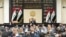 FILE - Iraqi lawmakers attend a parliamentary session to vote on the federal budget at the parliament headquarters in Baghdad, Iraq, June 11, 2023.