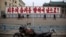 FILE - A propaganda billboard, which reads "Forward to the Ultimate Victory" in Korean is seen standing in central Kaesong, North Korea.