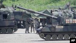 FILE - U.S. soldiers prepare for a military exercise in Pocheon, south of the demilitarized zone that divides the two Koreas, South Korea, Aug. 18, 2015.