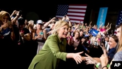 Democratic presidential candidate Hillary Clinton arrives to speak at a rally in Entertainment Hall at the Florida State Fairgrounds in Tampa, July 22, 2016.