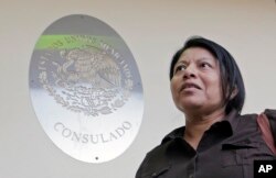 Undocumented immigrant Divina Ciriaco, of Mexico, talks to a reporter, at the Mexican Consulate, March 3, 2017, in Miami.