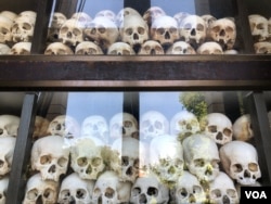 Skulls of victims from the Khmer Rouge period are kept at Choeung Ek killing fields in Phnom Penh, Cambodia. (Sun Narin/VOA Khmer)