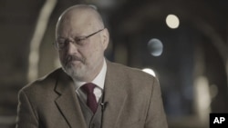 卡舒吉2018年3月出席一个活动（美联社）