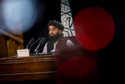 Taliban government spokesman Zabihullah Mujahid gives a press conference in Kabul, Afghanistan, Sept. 21, 2021.