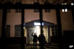 Russian opposition leader Alexei Navalny greets supporters as he leaves a police station in Moscow, Russia, Sept. 29, 2017.