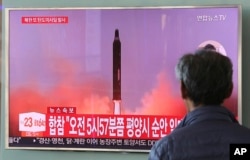 A man watches a TV screen showing a file footage of North Korea's missile launch, at the Seoul Railway Station in Seoul, South Korea, Aug. 29, 2017.