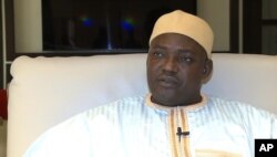 In this image taken from video, Gambia's new president Adama Barrow talks during an interview with The Associated Press in Dakar, Senegal, Jan. 21, 2017, just hours after Yahya Jammeh agreed to step down from office.