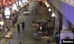 Bodies are seen outside Turkey's largest airport, Istanbul Ataturk, Turkey, following a blast, June 28, 2016.