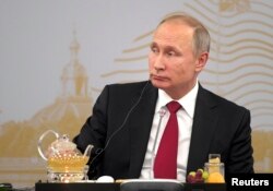 Russian President Vladimir Putin attends a meeting with heads of major foreign companies at the St. Petersburg International Economic Forum in St. Petersburg, Russia, June 2, 2017.