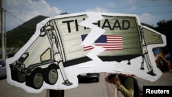 FILE - Protesters attend an anti-THAAD proest in Seongju, South Korea,June 14, 2017.