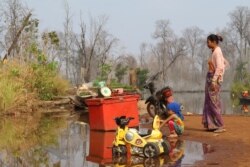 As river level rises in Stung Treng province’s Srekor commune,the Lower Sesan 2 dam begins to store water, on March 12, 2020. (Sun Narin/VOA Khmer)