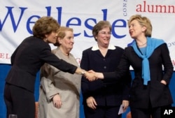FILE - From left, Wellesley College President Diana Chapman Walsh, former Secretary of State Madeline Albright, U.S. Court of Appeals Judge Susan P. Graber and then-Sen. Hillary Clinton gather onstage following a panel discussion before alumnae at Wellesl