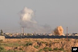 Smoke billows through the air during an offensive by Iraqi military forces into Fallujah to retake the city from Islamic State militants in Iraq, May 30, 2016.