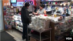 Along the downtown streets in Postville, Iowa, are stores run by people from Mexico, Somalia and, in this case, Guatemala. (G. Flakus/VOA)