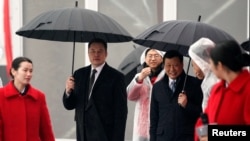 时任上海市长应勇和特斯拉CEO马斯克在上海出席投资50亿美元的特斯拉电动车超级工厂破土动工典礼（路透社2019年1月7日资料照）。