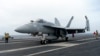A F-18E parks on the flight deck of a USS Theodore Roosevelt aircraft carrier on Thursday, April 11, 2024 during a three-day joint naval exercise by the U.S., Japanese and South Korea at the East China Sea.