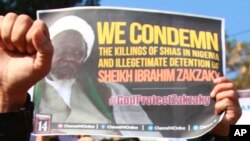 Muslims students carry placards and shout slogans against the Nigerian government against the killings of hundreds of Shiite Muslims and detaining their leader Ibraheem Zakzaky in Nigeria, in Jammu, India, Tuesday, Dec. 1 5, 2015. 