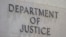 FILE - The outside of the Department of Justice building in Washington. The justice department says Mohammad Sharifullah has been charged with 'providing and conspiring to provide material support and resources to a designated foreign terrorist organization resulting in death.'