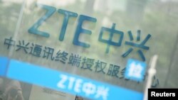 A sign of ZTE Corp is pictured at its service center in Hangzhou, Zhejiang province, China, May 14, 2018.