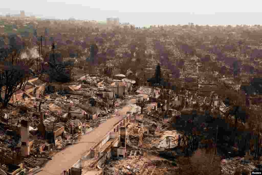 A view shows the remains of homes destroyed by the Palisades Fire in the Pacific Palisades neighborhood in Los Angeles, California, Jan. 11, 2025.