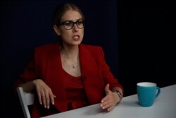 FILE - Russian opposition activist Lyubov Sobol speaks during an interview with the Associated Press in Moscow, Russia, Aug. 15, 2019.