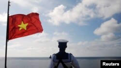 FILE - A Vietnamese naval soldier stands quard at Thuyen Chai island in the Spratly archipelago January 17, 2013. (Reuters)