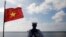 FILE - A Vietnamese naval soldier stands quard at Thuyen Chai island in the Spratly archipelago January 17, 2013. (Reuters)