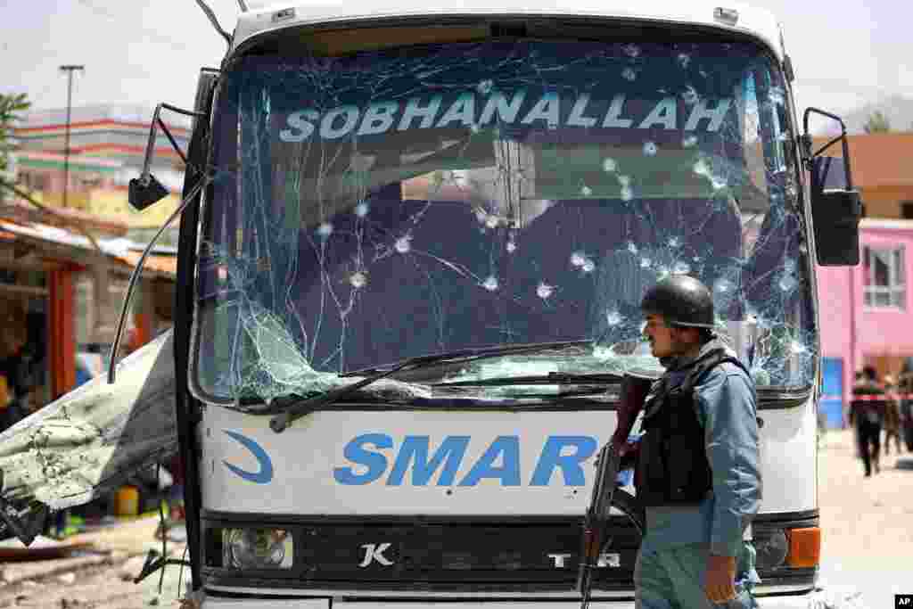 An Afghan official says a suicide bomber struck a minibus carrying government employees in Kabul, May 4, 2015. 