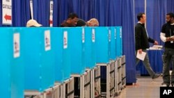 Voters cast ballots at the Chicago Early Voting Loop Supersite in Chicago, Oct. 24, 2024.