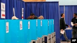 Voters cast ballots at the Chicago Early Voting Loop Supersite in Chicago, Oct. 24, 2024.