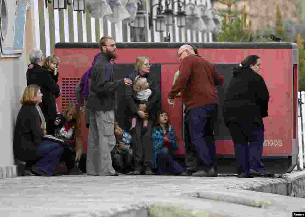 Foreigners evacuated by police from the site of an attack in Kabul, March 28, 2014.