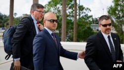 Walt Nauta, center, an aide to former U.S. President Donald Trump and co-defendant in the case regarding allegedly mishandled classified documents, arrives at the courthouse in Fort Pierce, Florida, on May 22, 2024.