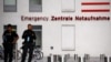 FILE - Police officers stand outside the Charite Mitte Hospital Complex, where Russian opposition leader Alexei Navalny is receiving medical treatment, in Berlin, Germany, Aug. 24, 2020.