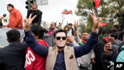 Supporters of former Pakistani Prime Minister Imran Khan chant slogans during a protest against the Pakistan Election Commission in Lahore, Pakistan, on March 2, 2024.