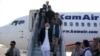 FILE - Afghanistan President Ashraf Ghani arrives in Mazar-i-Sharif to check the security situation of the northern provinces in Afghanistan, Aug. 11, 2021.