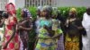 Schoolgirls, who escaped from Boko Haram kidnappers in the village of Chibok, arrive at the Government house to speak with State Governor Kashim Shettima, in Maiduguri, Nigeria, June 2, 2014.