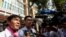 FILE - Uon Chhin and Yeang Sothearin, former journalists for U.S.-funded Radio Free Asia (RFA), speak to the media in front of the Municipal Court of Phnom Penh, in Phnom Penh, Cambodia, Oct. 3, 2019.