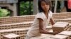 FILE PHOTO - A Cambodian girl prepares bricks to dry under the sunlight at a brick factory in Chheuteal village, Kandal province, some 27 kilometers (17 miles) north of Phnom Penh, Cambodia, Monday, May 2, 2011. 